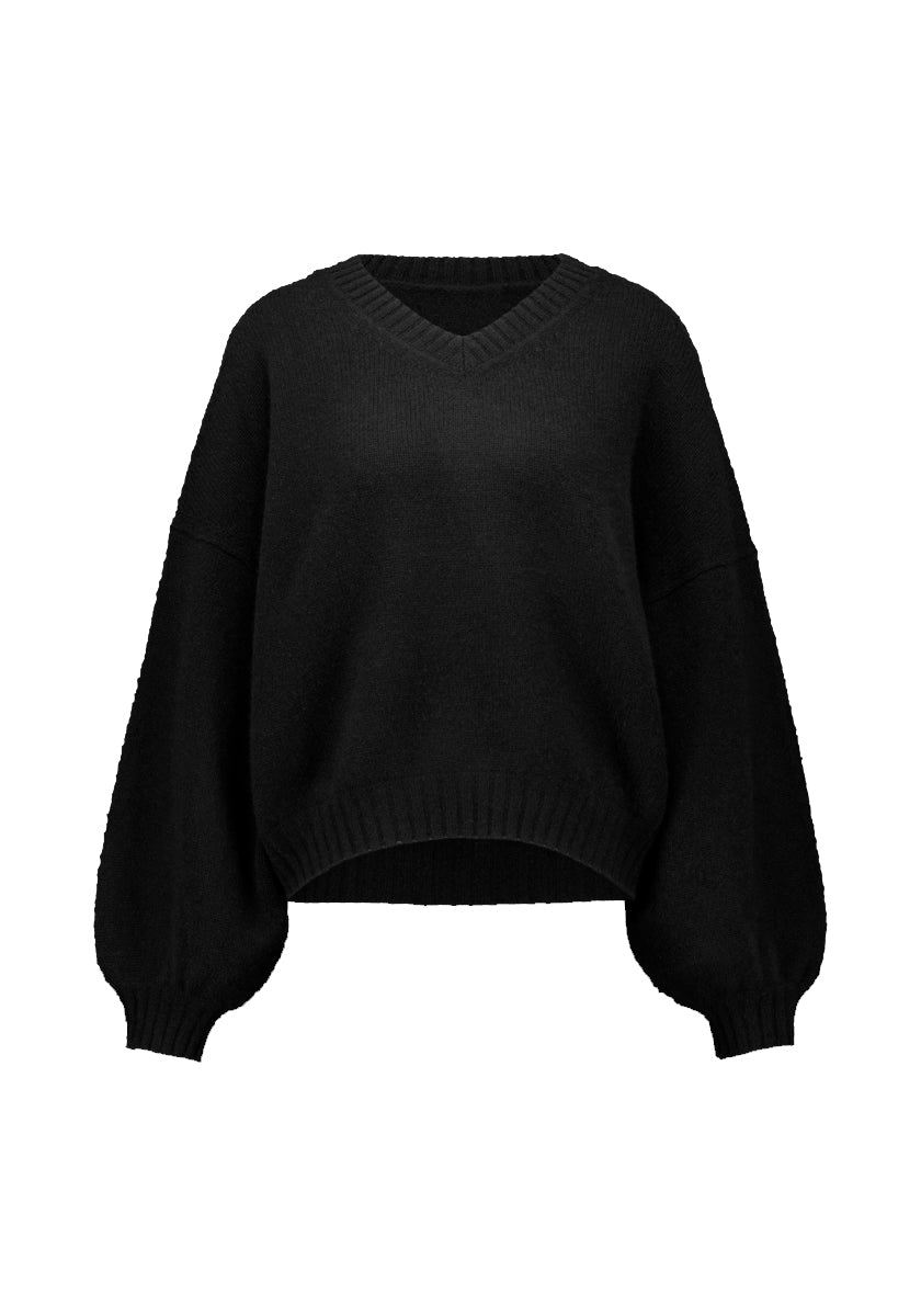 Der Princess Goes Hollywood Damen Kaschmirpullover ist ein schwarzer, locker geschnittener V-Ausschnitt-Pullover mit gerippten Bündchen und Saum, Ballonärmeln, die an den Handgelenken gerafft sind, einer entspannten taillierten Form und weichem, kuscheligem Stoff.