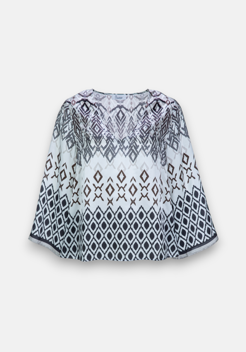 Loose-fitting long-sleeve blouse by Princess Goes Hollywood with a round neckline. Features a black and dark brown geometric print on white, including diamonds and crosses. Silk blend adds elegance.