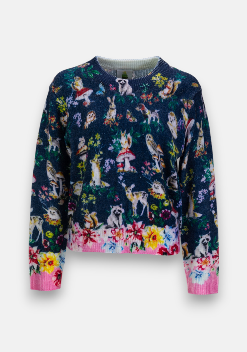 A colorful Strickpullover by Princess Goes Hollywood with whimsical rabbits, deer, and owls among flowers on dark blue. Ribbed pink and white striped cuffs, hem, and collar finish this relaxed fit Merinowolle sweater.