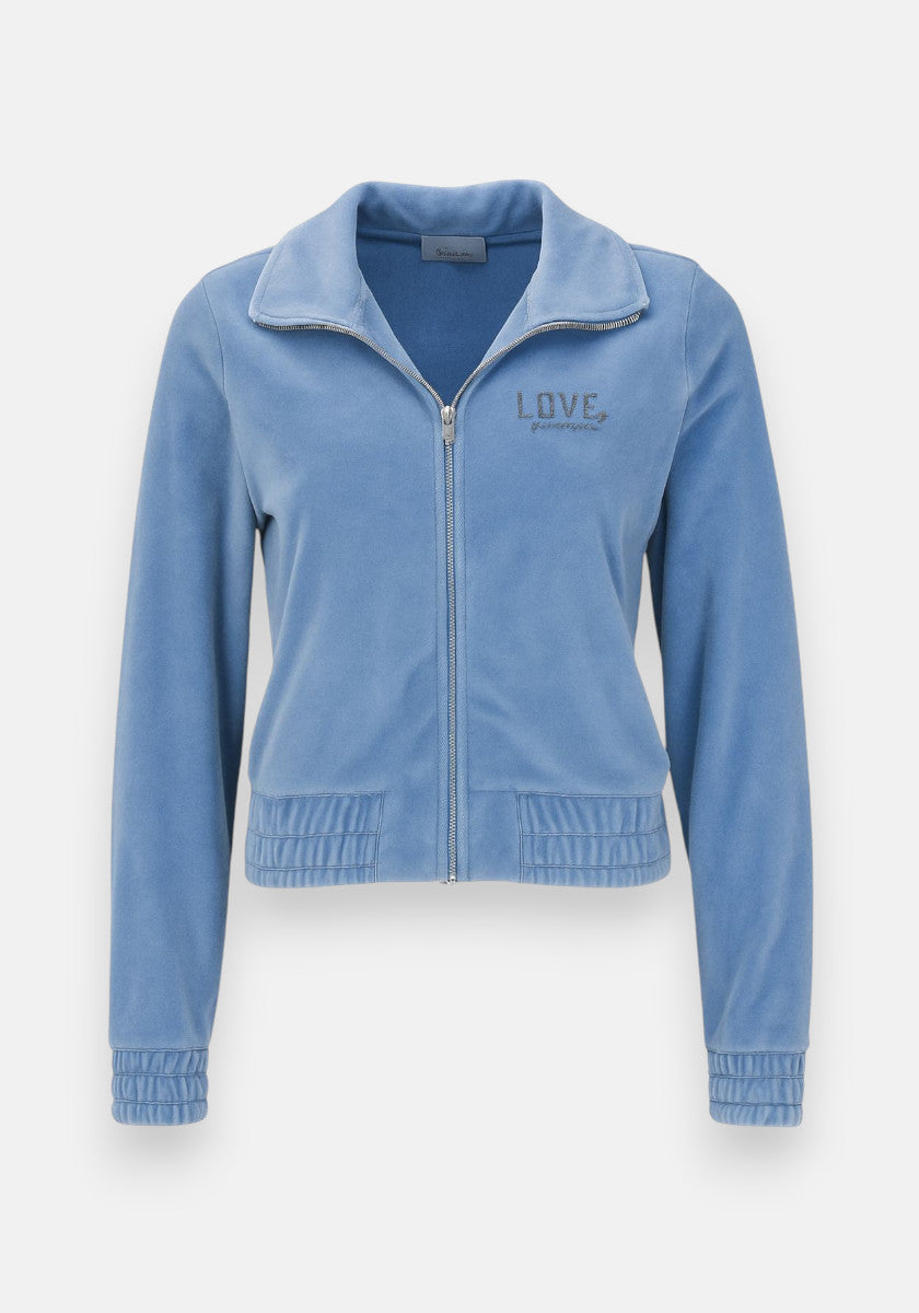 A light blue Princess Goes Hollywood Nicki-Stoff Sweatjacke with a zip Reissverschluss, collar, long sleeves, elastic cuffs and hem. “LOVE” and a heart are embroidered on the chest. Velvety fabric adds a plush, cozy look.