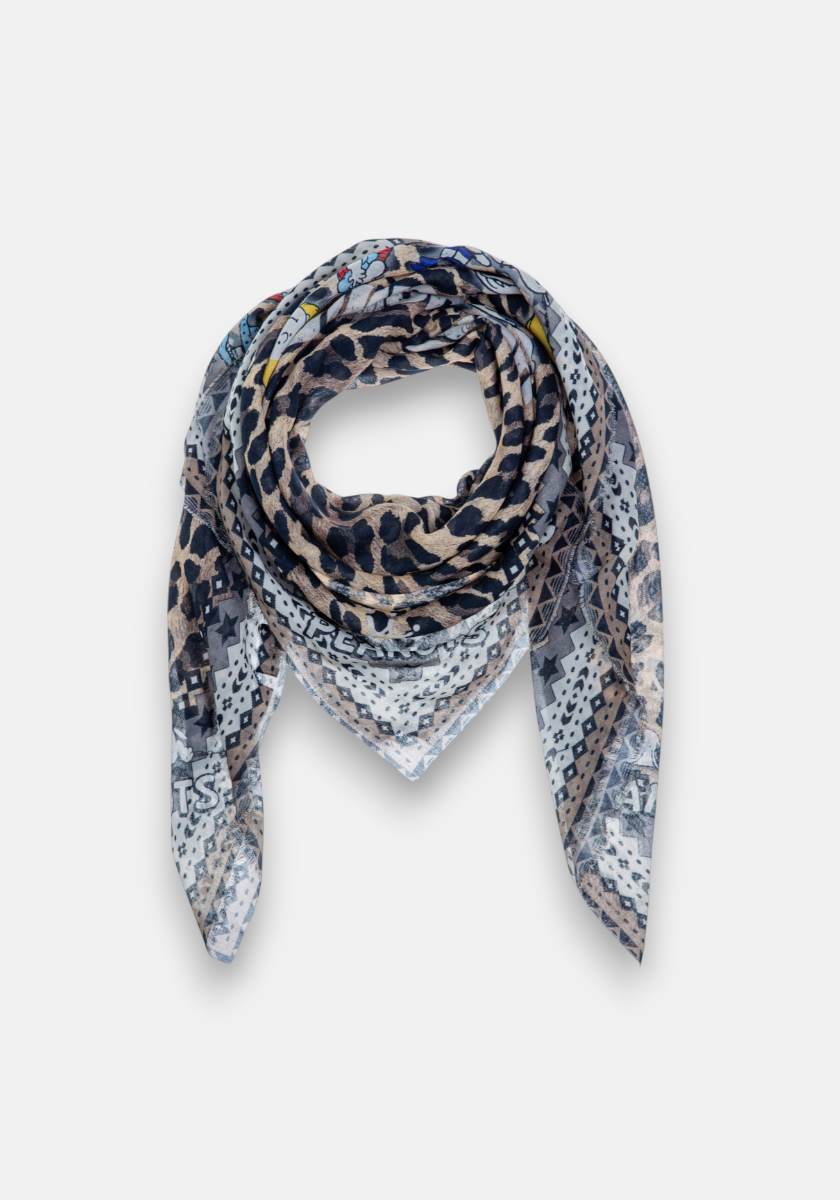 The Princess Goes Hollywood square scarf features pointed ends and a loose-loop style, showcasing Glam-Leo print, geometric patterns, and scattered text in neutral and blue on a light background. Made from semi-transparent, lightweight fabric.