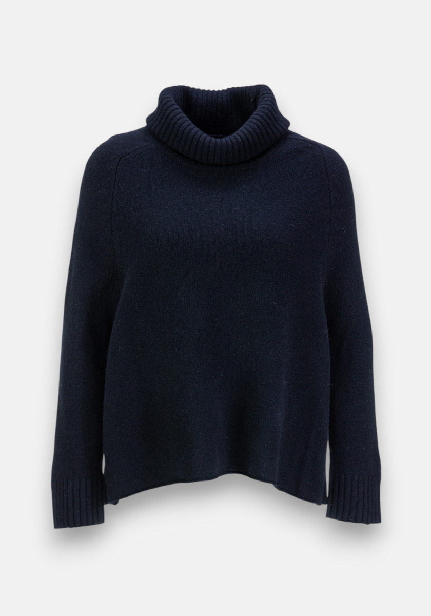 The Frogbox by Princess pullover is a plain dark navy Merinowolle sweater with a roll neck, long sleeves, and ribbed cuffs, collar, and hem. It has a relaxed, slightly boxy fit and is shown on a light gray background without any embellishments.