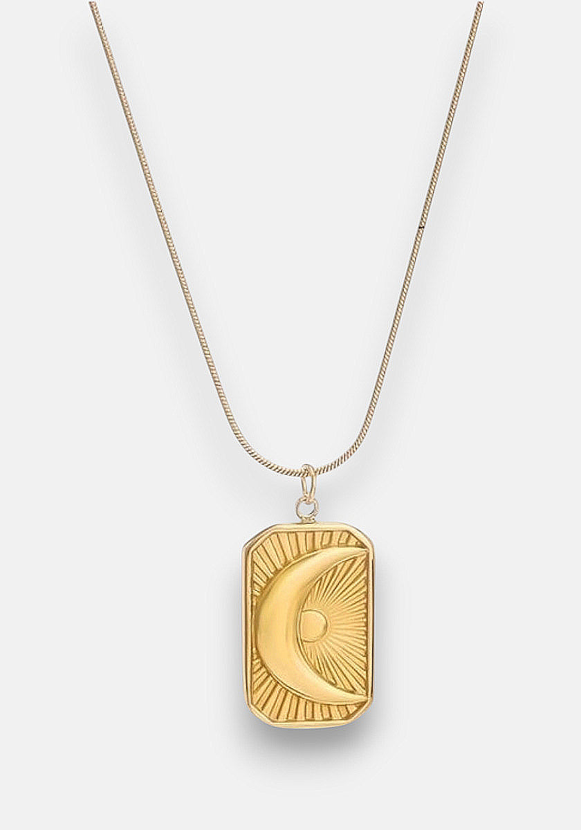 A gold Halskette by Princess Goes Hollywood, crafted from Edelstahl 304, features a rectangular Anhänger engraved with a crescent moon and radiating sunburst, hanging from a thin gold chain against a white background.