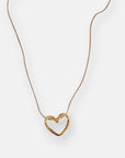 A delicate Princess Goes Hollywood goldene Halskette with a thin chain and a smooth, open Herzanhänger in a simple, modern design, shown against a plain white background.