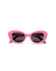 Okkia cat-eye sunglasses from the Kollektion feature bright pink frames, dark tinted lenses, and a bold retro design with thick curved edges and pointed outer tips, displayed front-facing on a white background.
