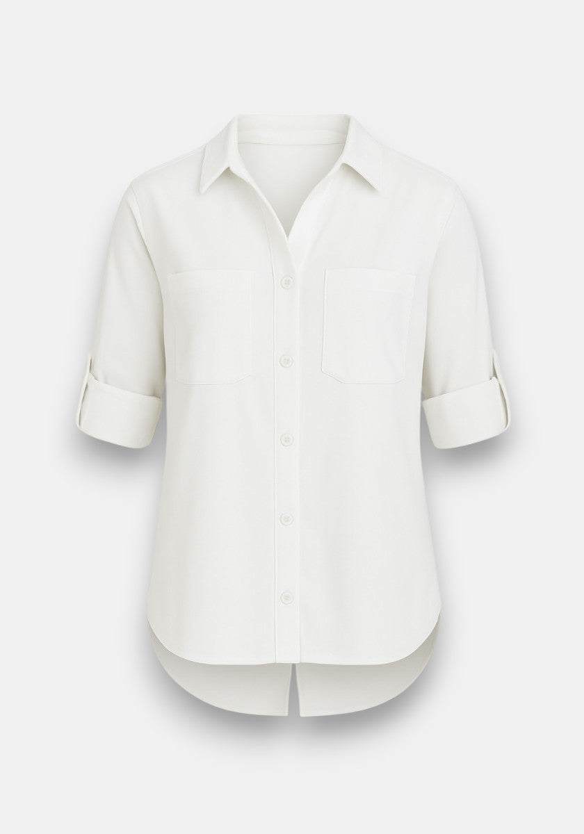 The Bella Dahl white long-sleeve Lyocell Hemd features a collar, two chest pockets, roll-tab sleeves, a curved hem, and subtle denim look. Displayed on a plain light background.