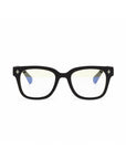Okkia black square-frame eyeglasses with slightly rounded edges feature small cross symbols on the front corners, clear lenses with a yellow tint, and blue soft-touch temple interiors.