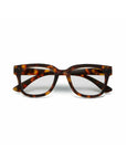 Okkia Bildschirmbrille with a rectangular frame in brown and amber tortoiseshell, shown front-facing on white. Features clear lenses, sturdy temples, and enhanced Tragekomfort for daily wear.