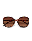 A pair of oversized Okkia ANNA sunglasses with a square butterfly-style frame in tortoiseshell brown and amber. Large, brown-tinted lenses provide full eye coverage and UV protection. Shown on a plain white background.