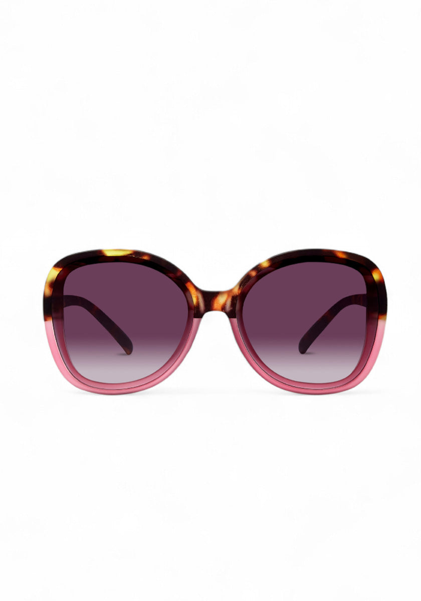 The Okkia ANNA oversized butterfly sunglasses feature a rounded, butterfly-shaped frame in tortoiseshell and translucent pink with gradient dark purple lenses that offer UV protection and fade lighter toward the bottom.