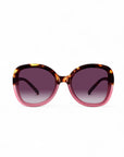 The Okkia ANNA oversized butterfly sunglasses feature a rounded, butterfly-shaped frame in tortoiseshell and translucent pink with gradient dark purple lenses that offer UV protection and fade lighter toward the bottom.