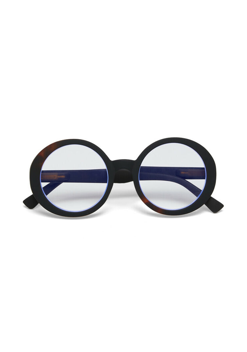 Okkia round eyeglasses with thick matte black Soft-Touch-Material frames and blue-tinted lenses. Oversize design with dark arms, featuring a hint of tortoiseshell at the hinges, displayed on a plain white background.