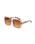 Okkia square-shaped oversized sunglasses feature a matte pink frame, brown gradient lenses with UV 400 protection, and tortoiseshell-pattern arms. Displayed angled on a white background.