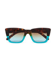 Okkia rectangular sunglasses with a thick frame feature a brown tortoiseshell upper half and bright turquoise lower half. The lenses are lightly tinted, with a gradient from dark at the top to lighter at the bottom.