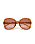 Front view of oversized, square Okkia ANNA Sonnenbrille in bold Butterfly-Stil with thick amber-orange translucent frames, brown gradient UV-Schutz lenses, and slightly visible amber arms. Shown on a white background.