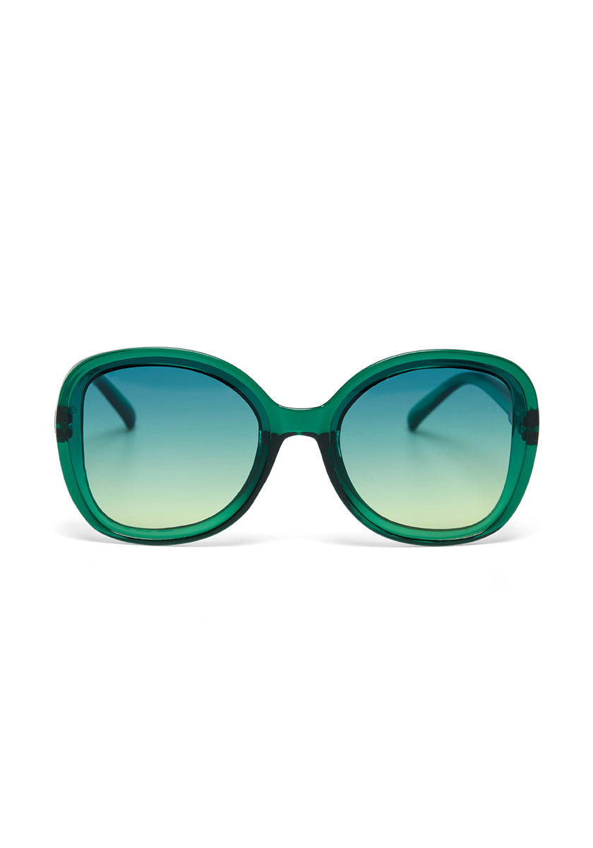 Okkia green-framed sunglasses in a glossy, oversized butterfly style feature large rounded lenses with a blue-to-clear gradient tint and UV protection. Gently curved arms add flair, all set against a plain white background.