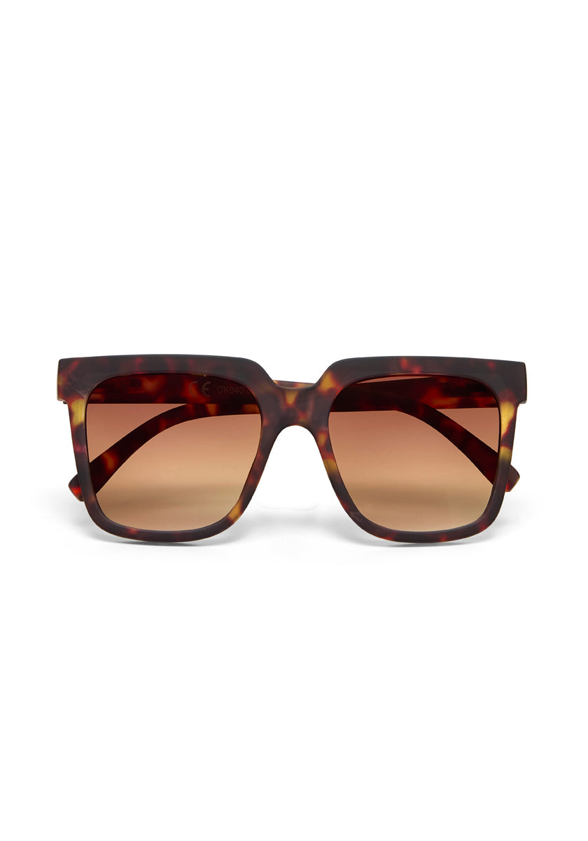 Okkias oversized square sunglasses feature dark tortoiseshell frames and brown gradient lenses, displayed front-on against a white background. The bold frames provide UV 400 protection for your eyes.