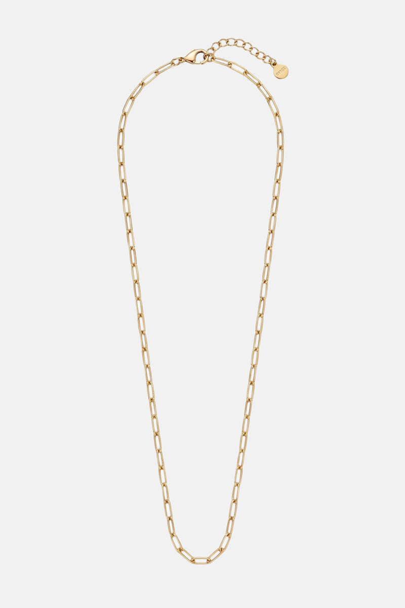 Die goldene „Princess Goes Hollywood“-Gliederkette aus Edelstahl besticht durch längliche, rechteckige Glieder, einen verstellbaren Verschluss und ein kleines rundes Anhängerchen am Verlängerungsstück – ein elegantes Stück minimalistischer Schmuck vor einem schlichten weißen Hintergrund.