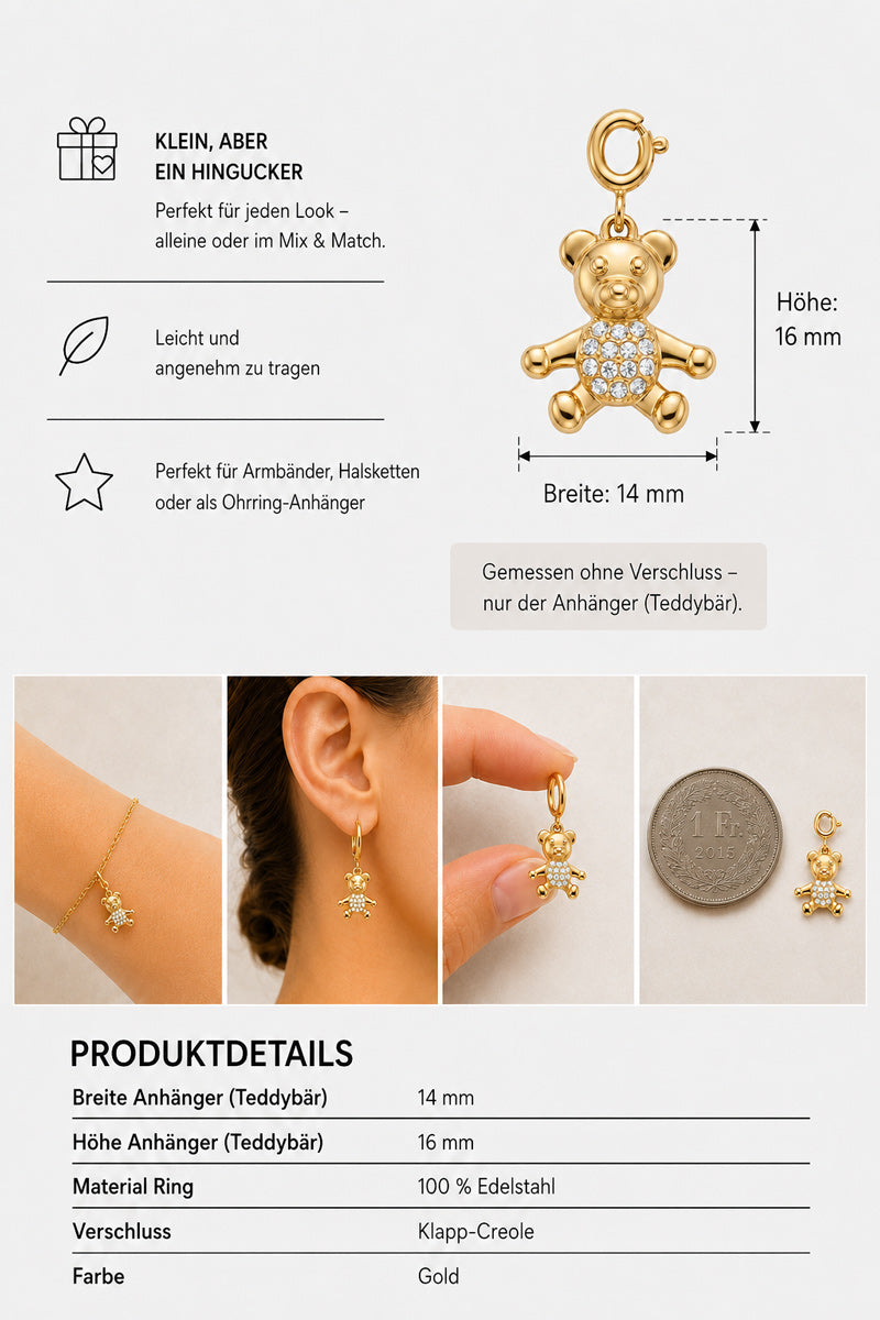 Ein funkelnder, mit Zirkonia besetzter goldener „Bär Charm“-Teddybär von Princess Goes Hollywood wird neben einer Münze als Größenvergleich gezeigt. Die Abbildung zeigt den Teddy als Ohrring und in einer Hand gehalten und gibt seine Maße an: 16 mm hoch, 14 mm breit. Der Text hebt Produktdetails wie die robuste Edelstahlkonstruktion, die Art des Verschlusses und Pflegehinweise hervor.