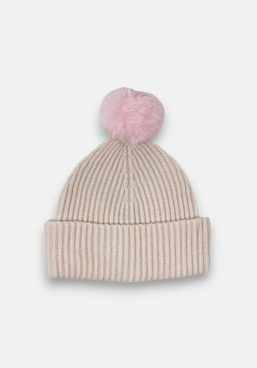 A light pink Rippstrick beanie by Princess Goes Hollywood with a folded brim and a large, fluffy pink pom-pom on top, displayed against a white background.