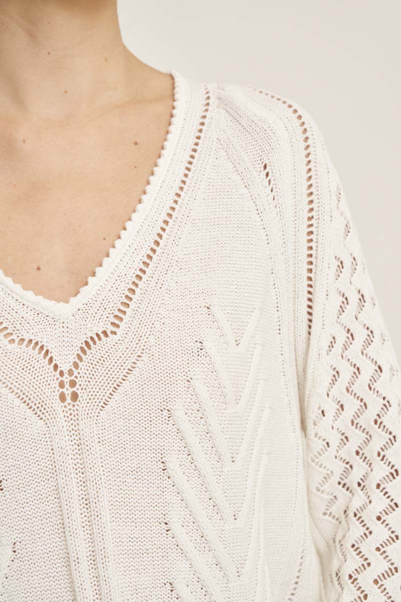 V-neck sweater with hole structure