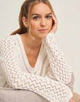 V-neck sweater with hole structure