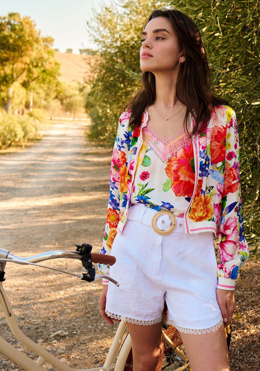 Lady with white trousers and summer blouse on a path in Provence