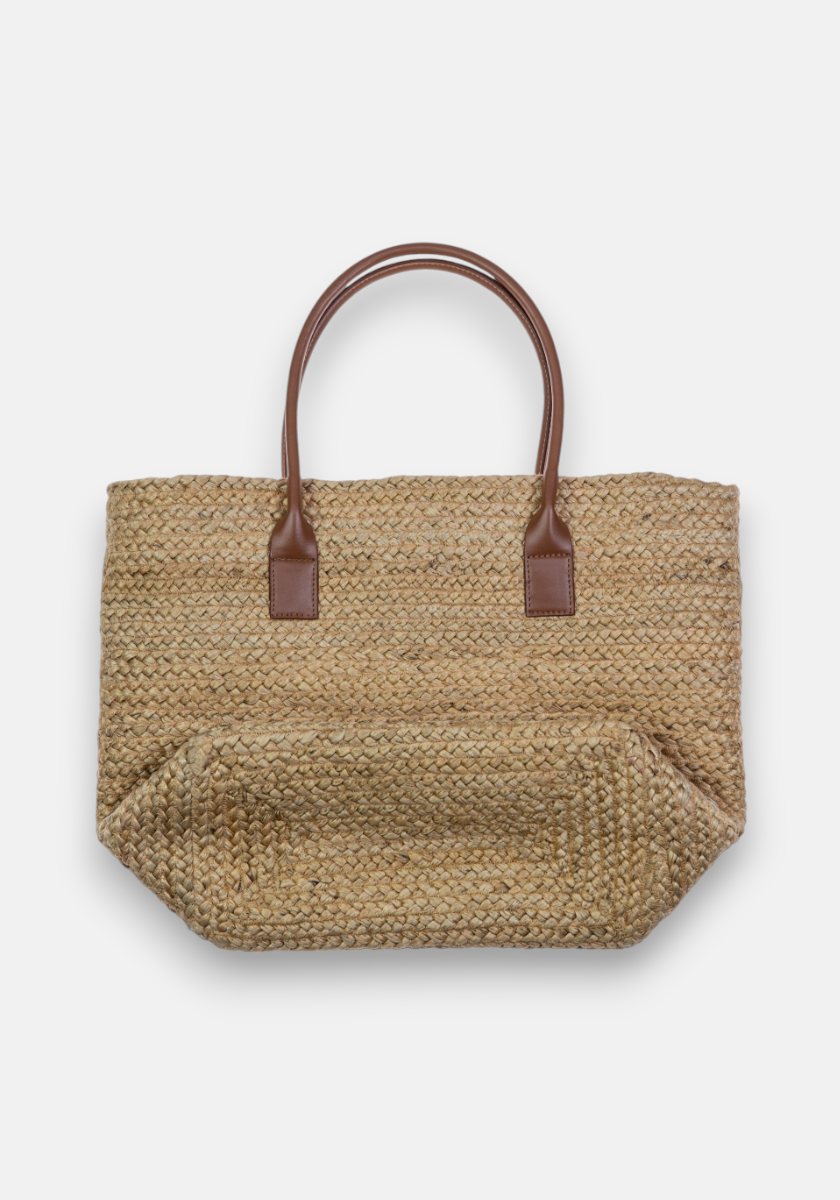 The Princess Goes Hollywood Raffiabast tote bag has two medium-brown leather handles, matching base accents, and a roomy rectangular design with textured detailing for effortless beach style against a plain white background.