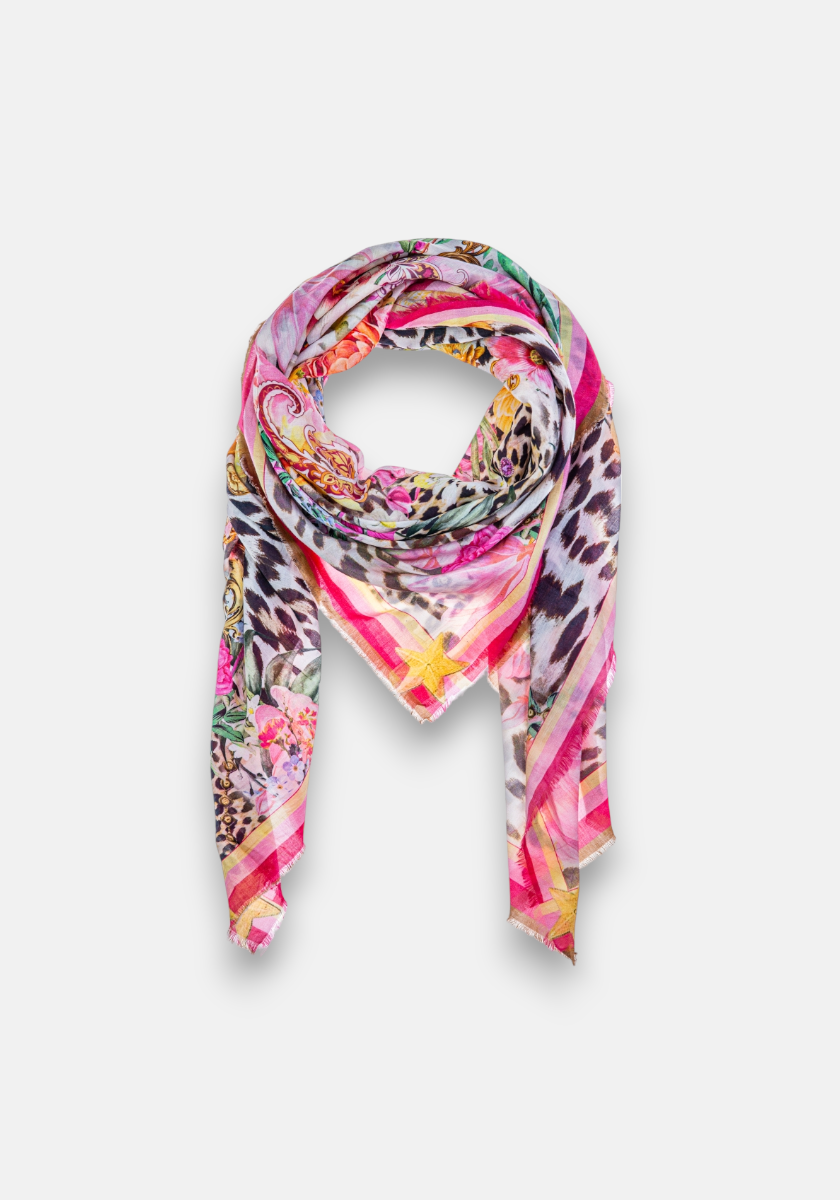 The Pareo Leo-Flower by Princess Goes Hollywood features a bold mix of leopard, floral, and paisley prints in pink, yellow, green, and black on white—a vibrant statement scarf crafted from a luxurious cotton-silk blend.