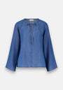 The Blaue Lyocell Bluse mit weiten Ärmeln by Princess Goes Hollywood features wide long sleeves, a relaxed fit, round neckline with ruffle and tie detail, stitched hems, and a casual style. Shown on a plain white background.
