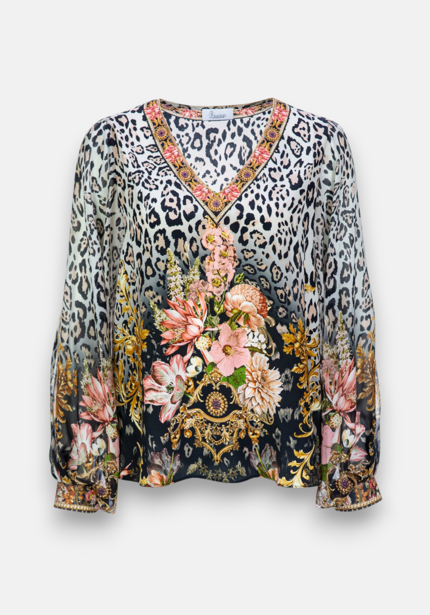 This Princess Goes Hollywood long-sleeve blouse is crafted from silk with a deep V-neck, featuring a vibrant floral leopard print in pink, gold, and white. Gold accents highlight the neckline and cuffs. The fit is slightly loose and flowing.