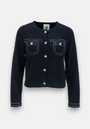 A navy blue, long-sleeve Merino-Kaschmir-Strickjacke by Princess Goes Hollywood with white stitching, four metallic buttons, two chest pockets with button closures, a classic Rundhalsausschnitt, and a plain light gray background.