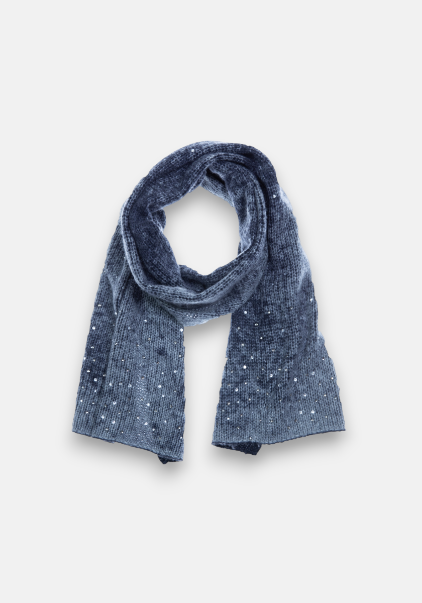 A soft, dark blue knitted scarf by Princess Goes Hollywood in a Merino-Kaschmir-Mix is arranged in a loop with both ends hanging. Subtle white speckles add a shimmering effect against the light gray background.