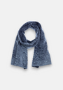 A soft, dark blue knitted scarf by Princess Goes Hollywood in a Merino-Kaschmir-Mix is arranged in a loop with both ends hanging. Subtle white speckles add a shimmering effect against the light gray background.
