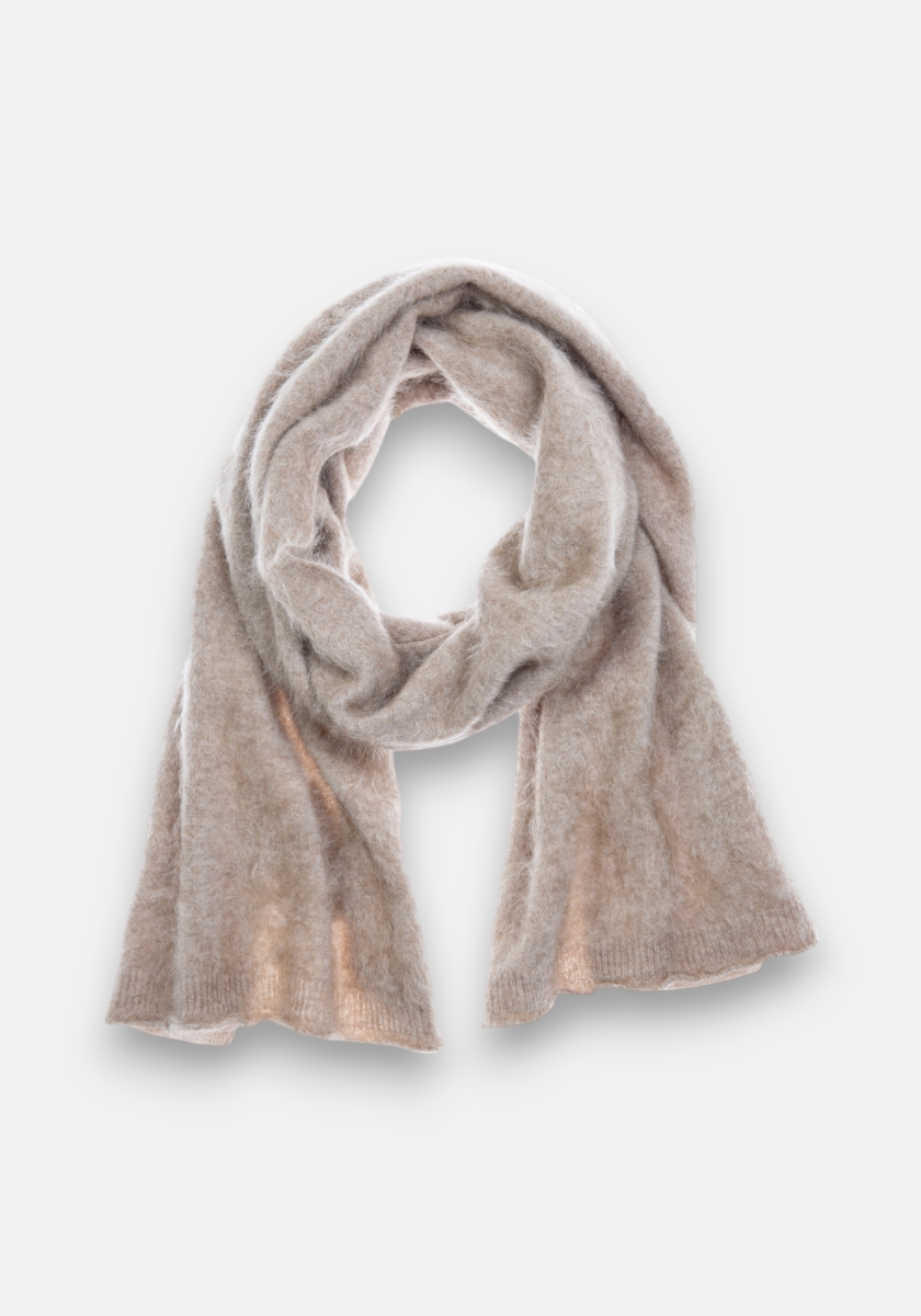 A soft, light beige Kaschmir Schal by Princess Goes Hollywood lies loosely draped in a circle on a plain, light gray background. Made from 100% Kaschmir, it features a fuzzy texture and gently curled ends for a cozy look.