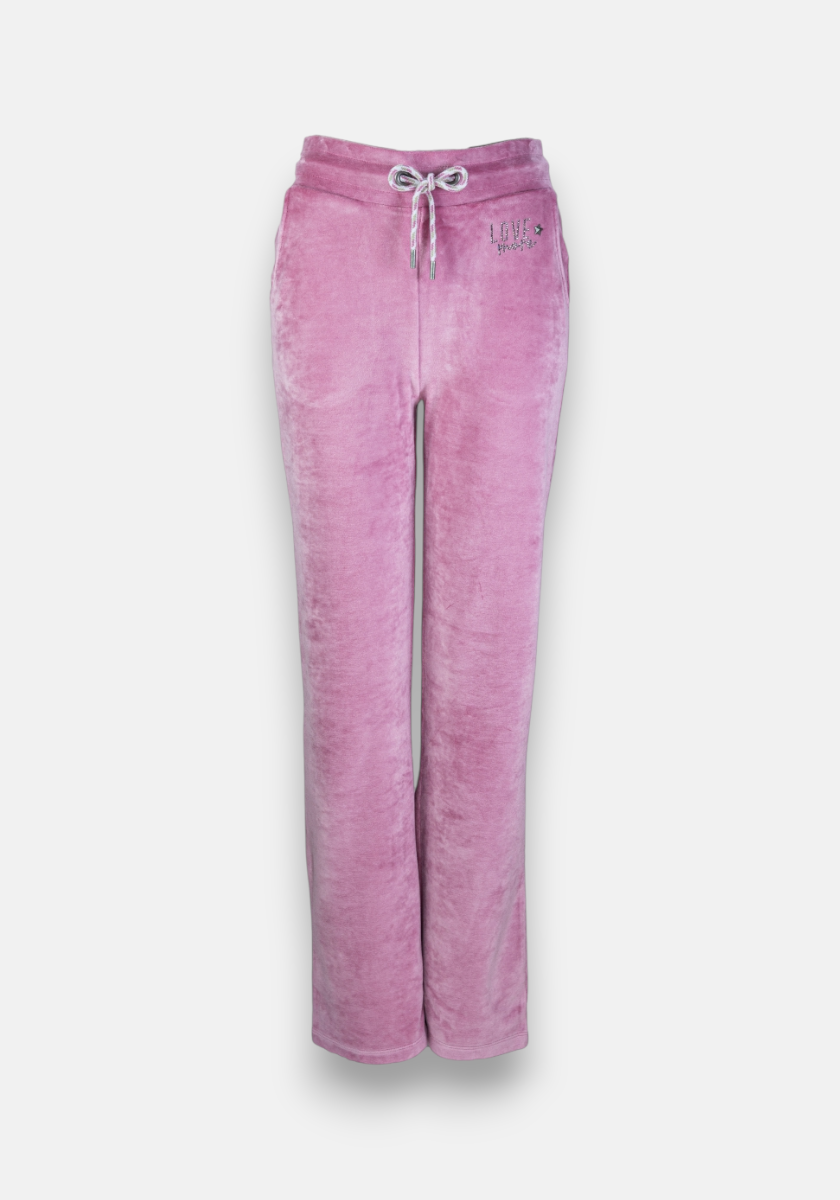 Light pink Princess Goes Hollywood Nicki fabric sweatpants with white drawstring waist, side pockets, and LOVE is the ingredient text on the left hip. Relaxed straight-leg fit with subtle rhinestone details. Shown on a gray background.