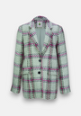 The Princess Goes Hollywood blazer is single-breasted with notch lapels and a white, black, and pink check pattern. It has two black front buttons, long sleeves, a straight cut, and is shown against a plain white background.