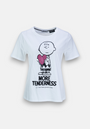 A white Princess Goes Hollywood Baumwolle T-shirt with short sleeves shows a black outline of Charlie Brown holding a pink sequined heart, with "MORE TENDERNESS" and "TAKE CARE of EACH OTHER" in black below.