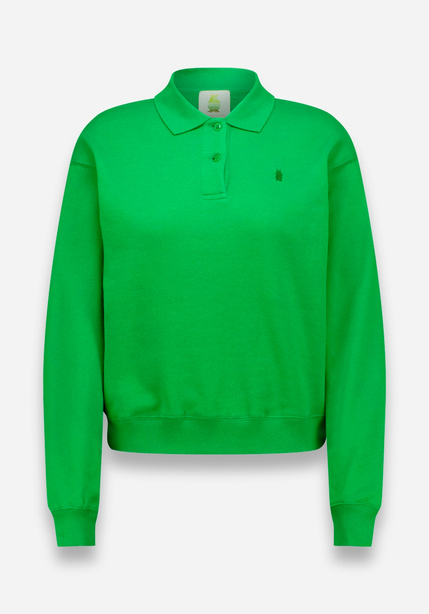 Das hellgrüne Langarm-Poloshirt von Princess Goes Hollywood hat einen Polokragen, drei Knöpfe, weichen Baumwollstoff, gerippte Bündchen und Saum und ein kleines gesticktes Logo auf der linken Brustseite. Es wird auf einem einfarbig weißen Hintergrund angezeigt.