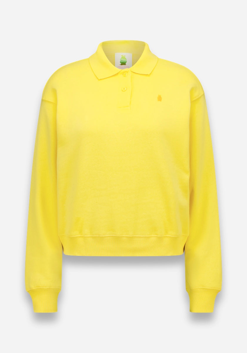 Ein leuchtend gelbes, langärmeliges Poloshirt von Princess Goes Hollywood mit Polokragen, Zwei-Knopf-Ausschnitt, gerippten Bündchen und Saum, weichem Baumwollstoff, dezenter Logostickerei auf der linken Brustseite und einer lockeren Passform auf weißem Grund.