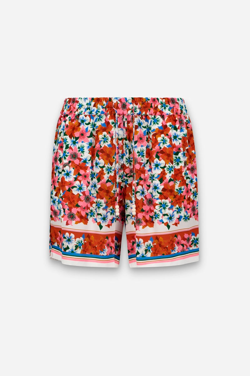 Diese Seidenshorts in limitierter Auflage von Princess Goes Hollywood zeigen einen lebhaften Blumenprint in Rot, Rosa, Blau und Weiß auf strahlend weißem Grund, mit einem breiten elastischen Bund und horizontal gestreiften Akzenten an den Säumen.