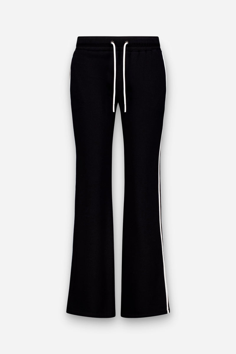 „Princess Goes Hollywood“ Limited Edition – schwarze Sweathose mit ausgestelltem Bein, gefertigt aus weicher Baumwolle, mit weißem Kordelzug am elastischen Bund und markanten weißen Seitenstreifen. Abgebildet auf einem einfarbigen hellgrauen Hintergrund.