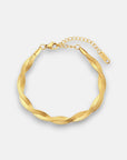 A gold twisted Gliederarmkette by Princess Goes Hollywood with a textured herringbone design in 18K Goldbeschichtung, featuring a lobster clasp, adjustable extension chain, and a rectangular tag on a plain white background.