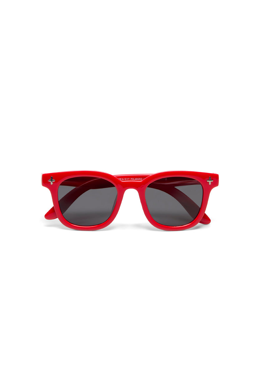 A pair of Okkia Kinder-Sonnenbrille sunglasses featuring bold, glossy red flexible TPEE frames, dark tinted lenses, and classic wayfarer shape with silver cross accents for zuverlässigen Schutz on a plain white background.