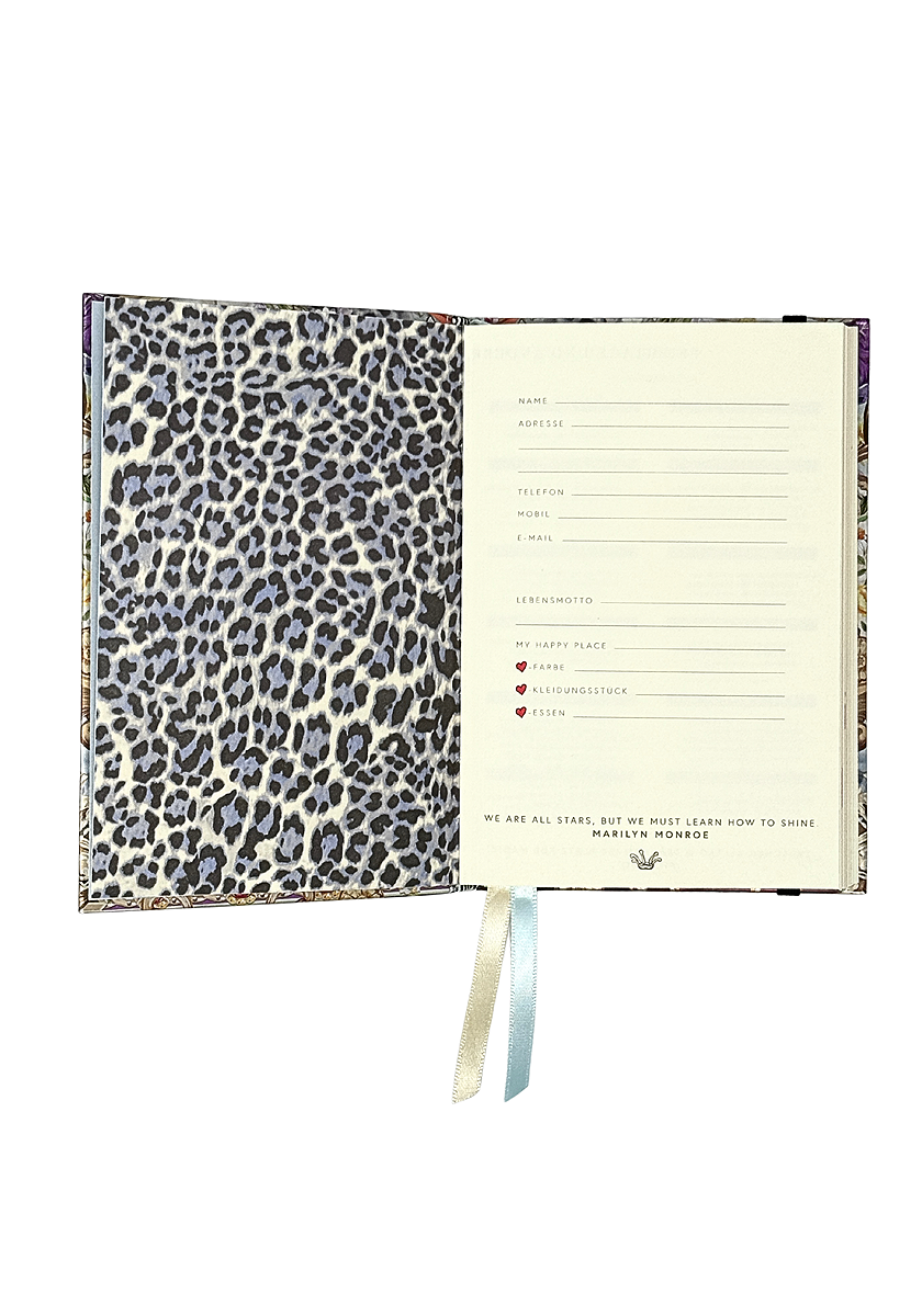 An open Princess Goes Hollywood notebook shows a left page with leopard print and a right page for your details—ideal for starting your 2026 planner. Two ribbon bookmarks hang below, ready for your next entry.