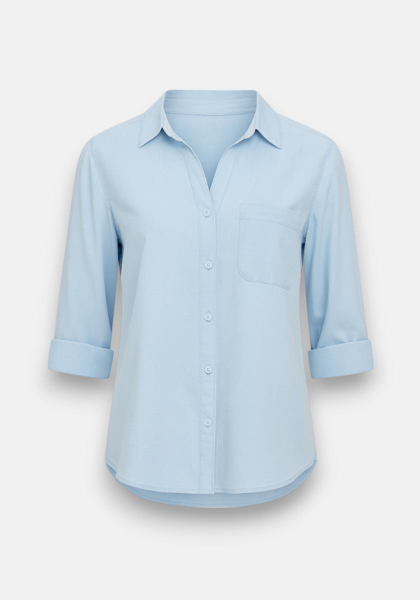 Bella Dahl light blue long-sleeve Hemdbluse featuring an oversized fit, classic collar, left chest pocket, and rolled sleeves just below the elbows. Made from soft Lyocell and shown facing forward on a plain white background.
