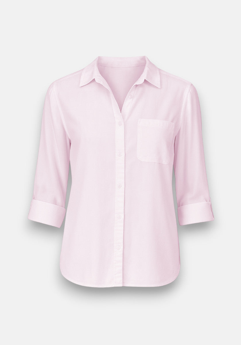 A light pink oversized Hemdbluse by Bella Dahl, featuring a collar, chest pocket, and rolled three-quarter sleeves, displayed on a plain light gray background.
