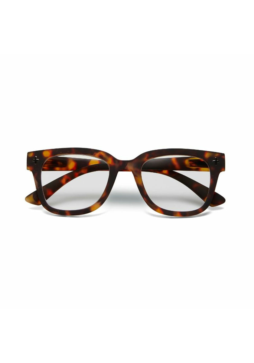 A pair of Okkia eyeglasses with rectangular frames in a brown and amber tortoiseshell pattern, seen from the front on a white background. The glossy square-frame design has slightly curved arms and subtle side hinges.