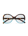 Front view of Okkia oversized Lesebrille with Soft-Touch finish, tortoiseshell upper frame and temples, light blue lower half. Features large rounded lenses, crossed temples, and a chic butterfly design.